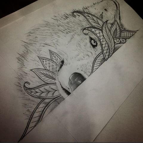 Gorgeous half-muzzle wolf with leaf decorations tattoo design