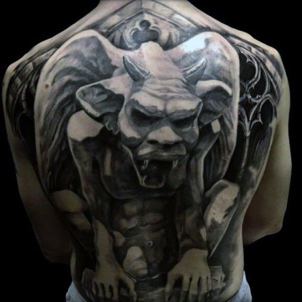 Gray washed style large whole back tattoo of stone gargoyle statue