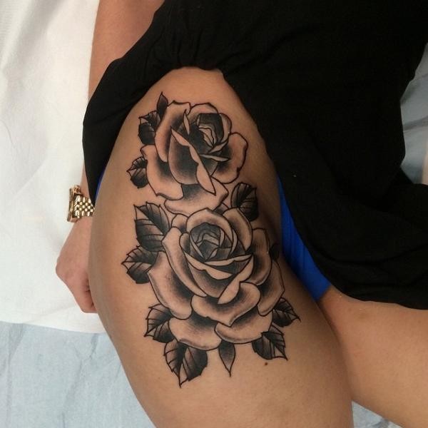 Great big rose flowers tattoo on thigh