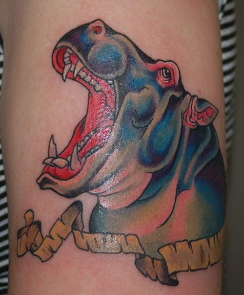 Great colorful hippo head with yellow ribbon tattoo