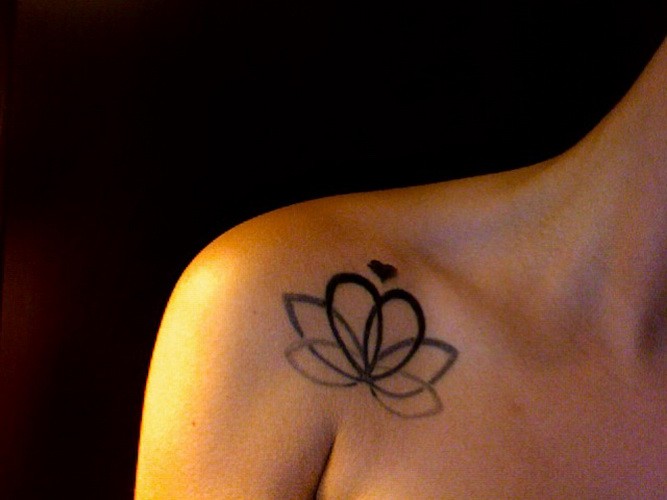 Great heart-shape lotus flower tattoo on chest