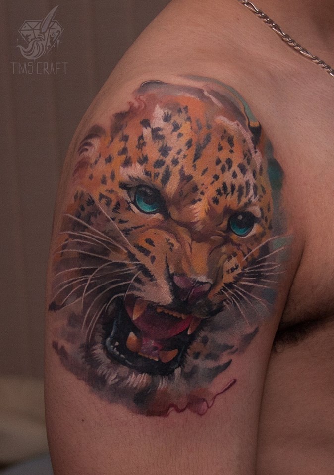 Great leopard head tattoo on shoulder