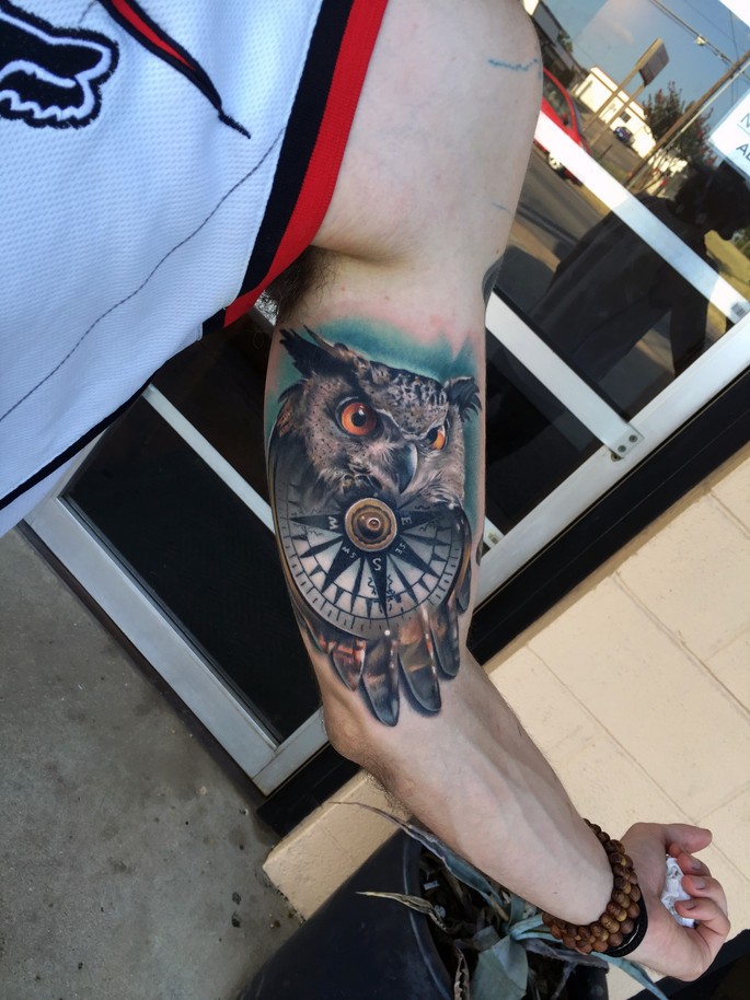 Great owl and compas tattoo on arm