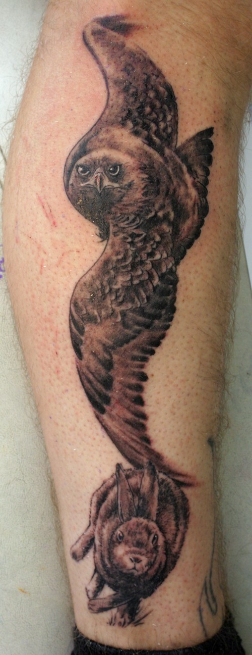 Great realistic hare and owl tattoo on shin