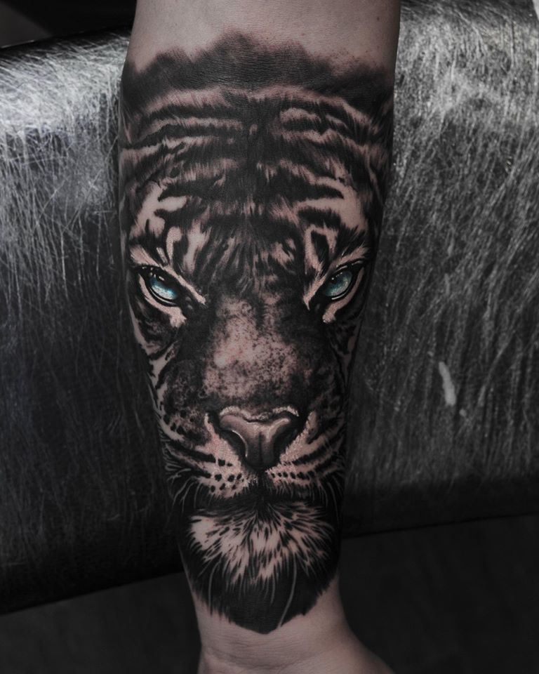 Great tiger face tattoo on forearm