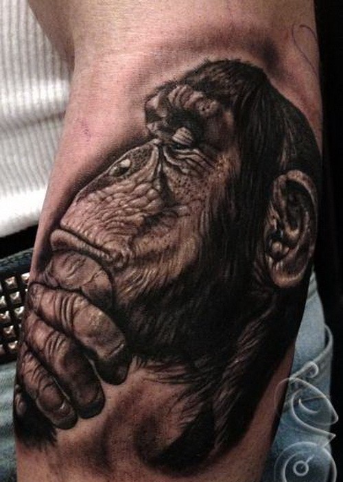 Great uncolored thinking chimpanzee tattoo on arm