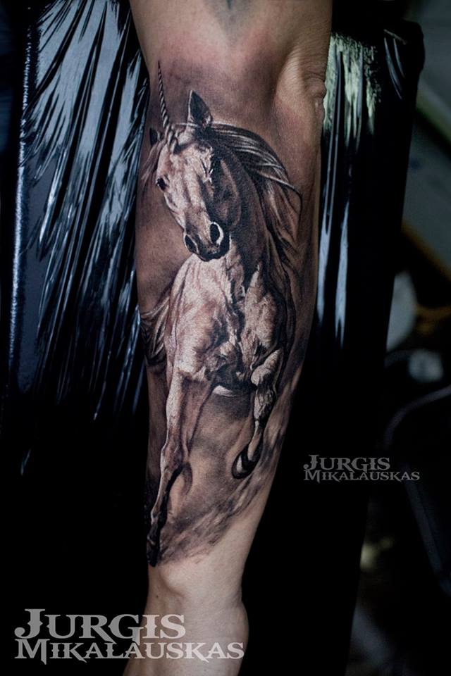 Great unicorn tattoo on forearm