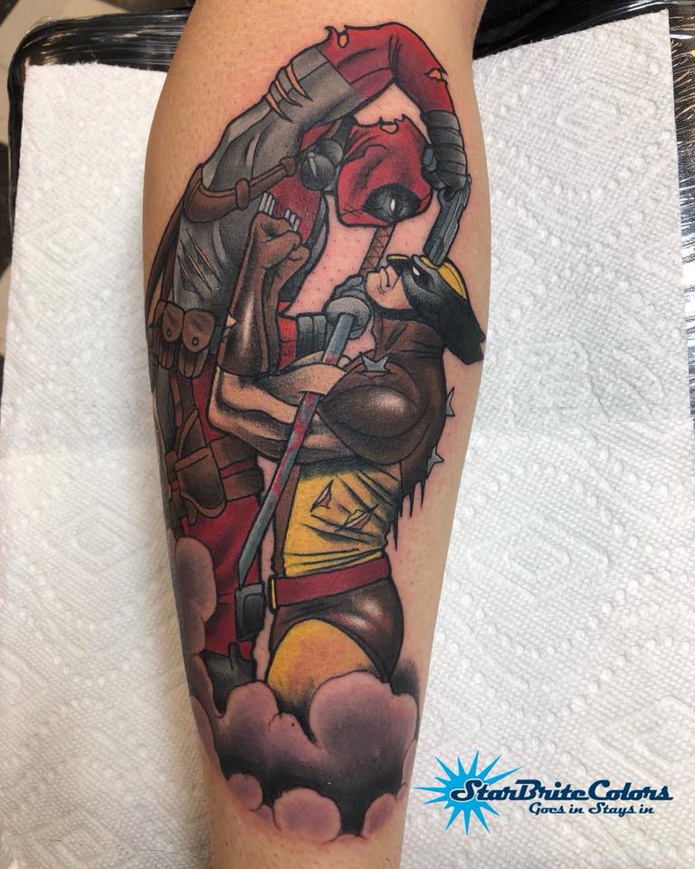 Great wolverine and deadpool tattoo