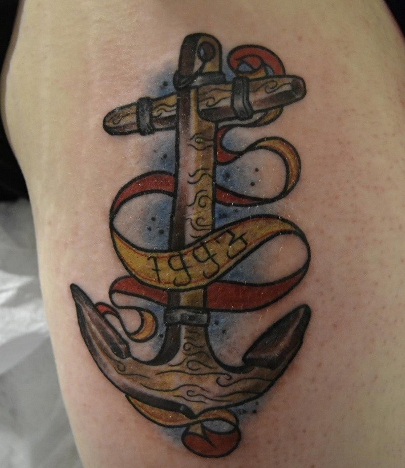 Great wooden anchor with lettered ribbon tattoo on thigh