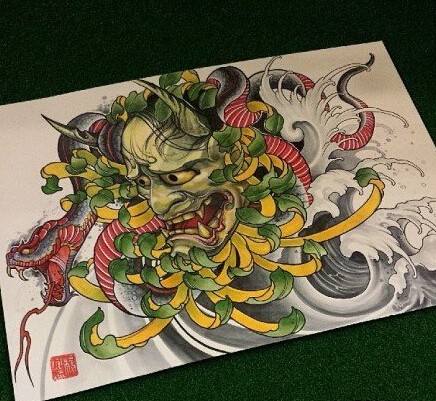 Green-and-yellow devil head in peony bud and red-belly snake tattoo design
