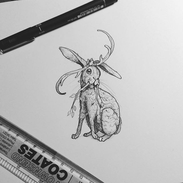 Grey-ink hare with bended horns and branch tusks tattoo design