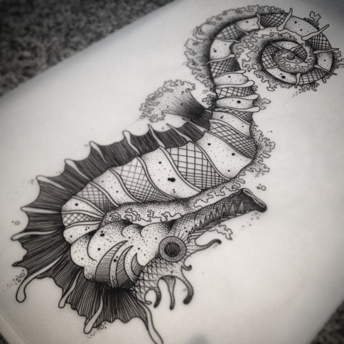 Grey-ink striped seahorse with sharp teeth and fluffy floppers tattoo design