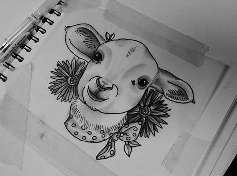 Grey-ink young sheep head with flowers tattoo design