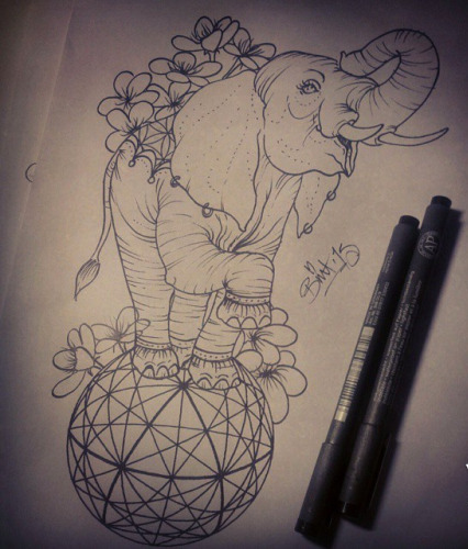 Happy new school elephant standing on geometric ball tattoo design