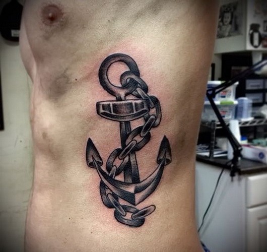 Harsh black-and-white chained anchor tattoo for men on rib-side