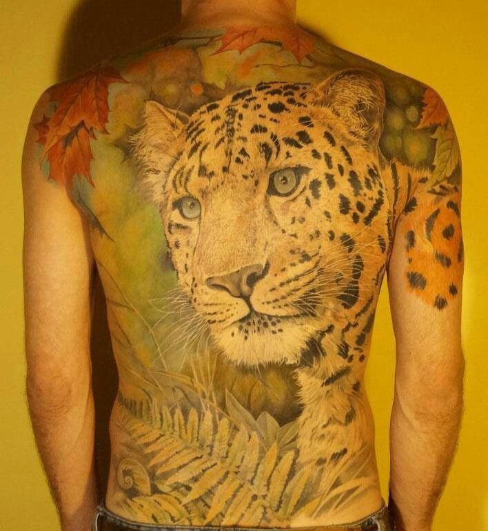 Huge amazing colorful cheetah in tropics tattoo on back