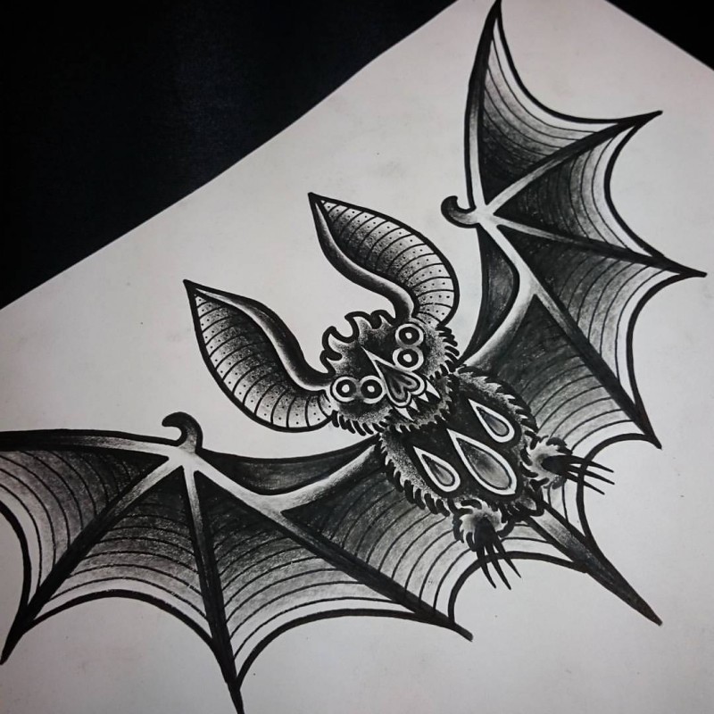 Impressive grey-ink four-eyed bat tattoo design
