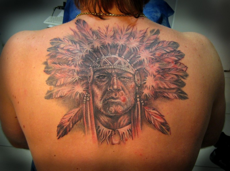 Indian head with feathers tattoo on back