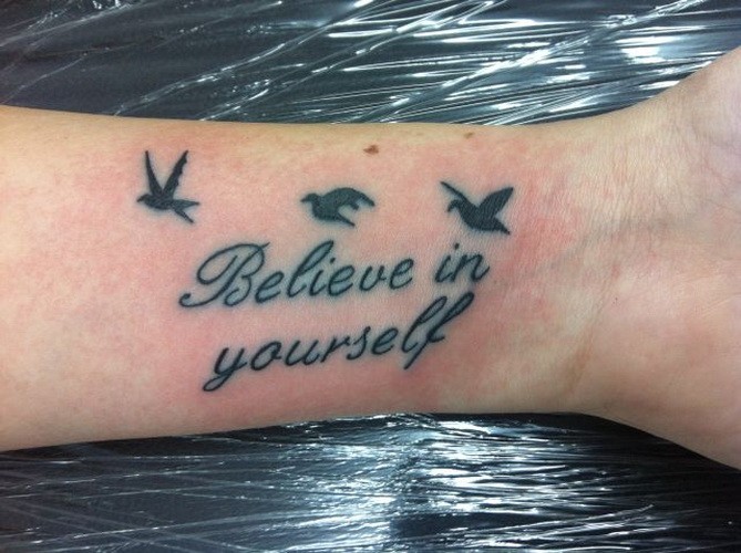 Inspire believe in yourself quote with birds tattoo on arm