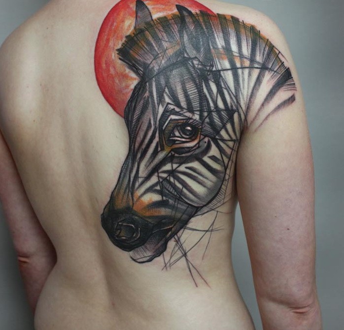 Interesting-designed color-ink zebra head and red sun tattoo on upper back