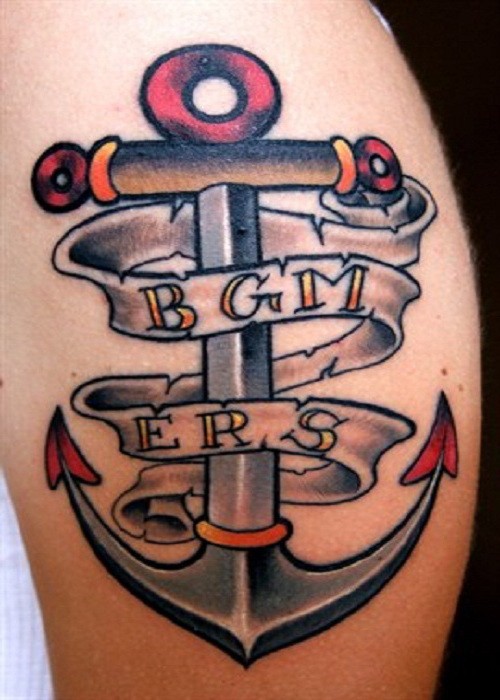 Iron anchor with lettering tattoo on shin