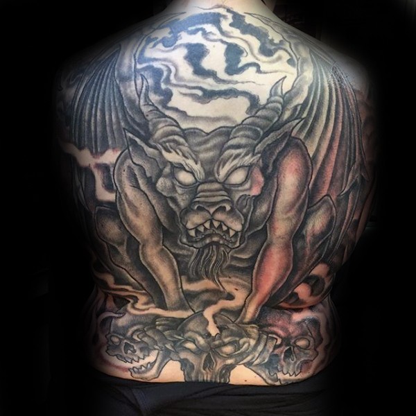 LArge old looking gargoyle with skulls tattoo on whole back