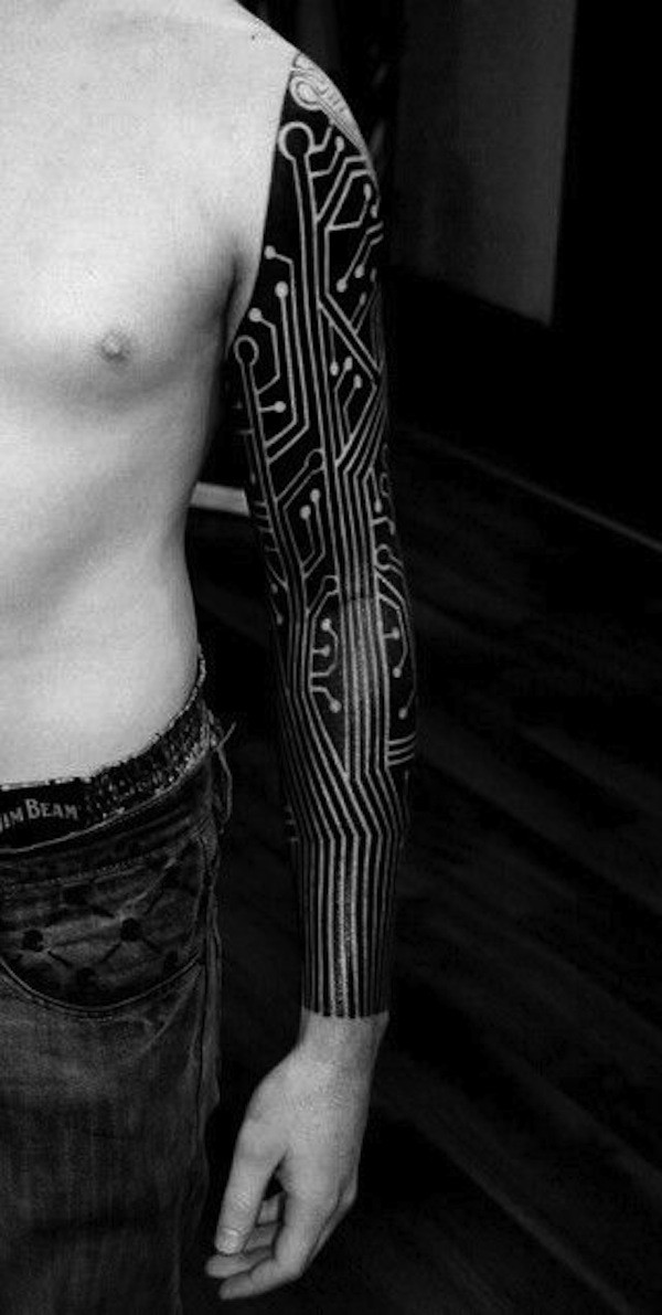 Large black mechanical scheme tattoo on arm