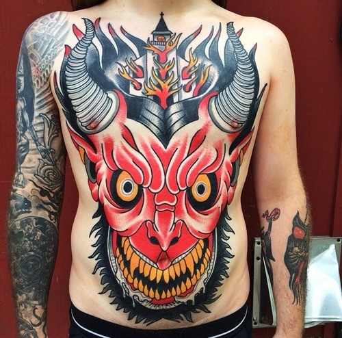 Large old school style chest and belly tattoo of devils head with burning church