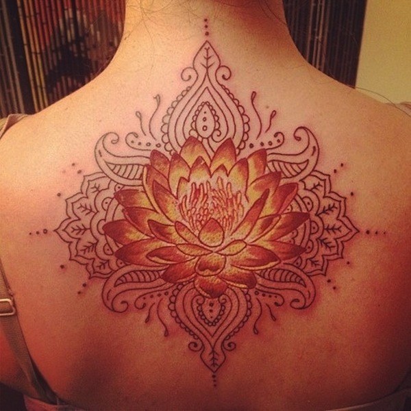 Large red-and-orange tribal lotus flower tattoo on back