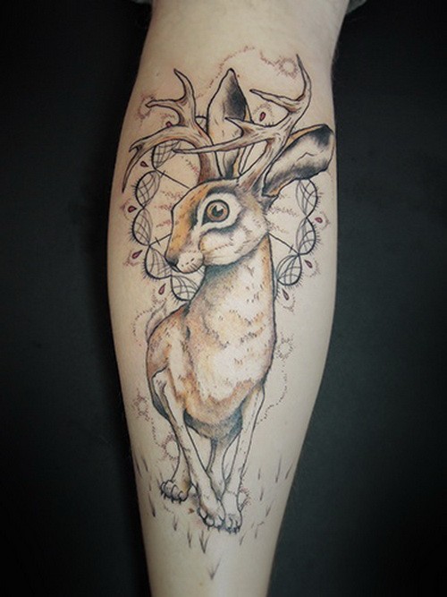 Large unusual colorful hare with deer hornes tattoo on shin