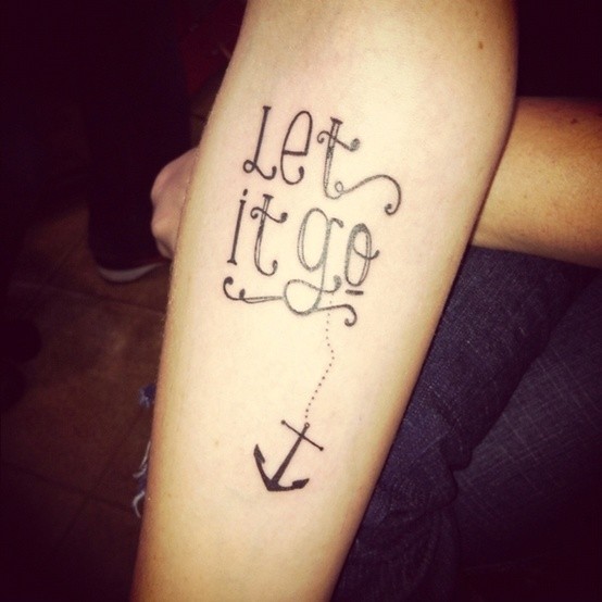 Let it go quote with anchor tattoo on forearm