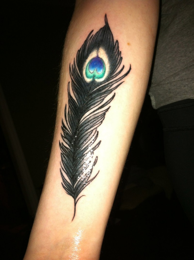 Little black peacock feather tattoo on arm