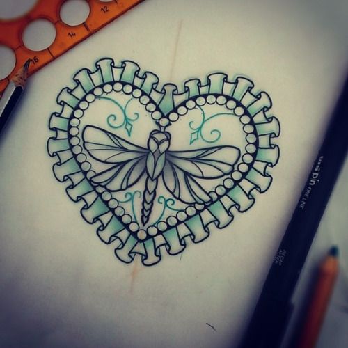 Little dragonfly in lace decorated heart frame tattoo design