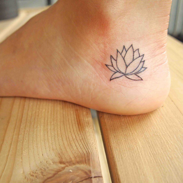 Lovely simple lotus flower tattoo on foot