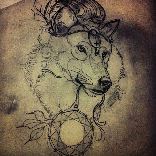 Luxury wolf in feathered wreath hanging a medallion tattoo design
