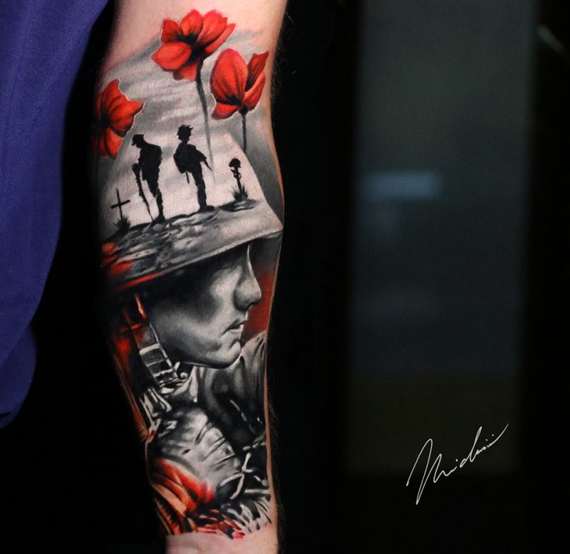 Military theme tattoo on arm