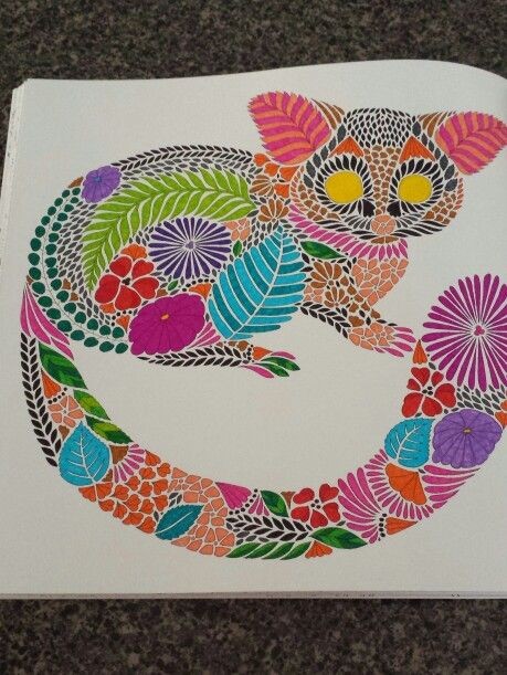 Multicolor floral-patterned lemur with shining projector eyes tattoo design