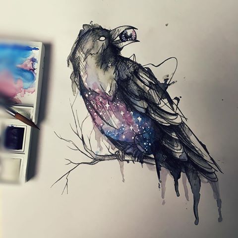 Mystic space-patterned raven keeping an eye in a beak tattoo design