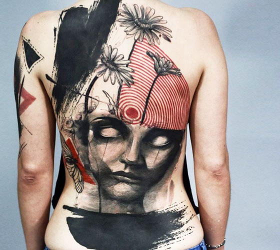 NEw school style large whole back tattoo of demonic face with flowers abd fly