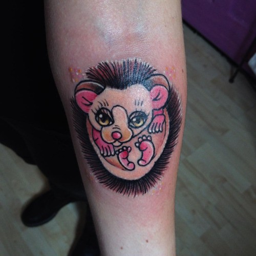 Nice girly pink hedgehog tattoo on arm