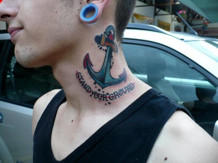 Old school anchor with stand your ground lettering tattoo on neck