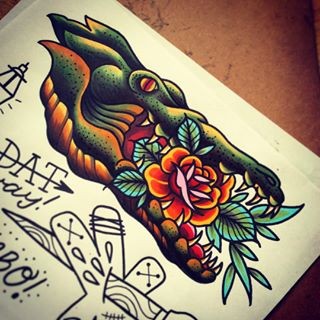 Old school colorful reptile head with rose inside tattoo design
