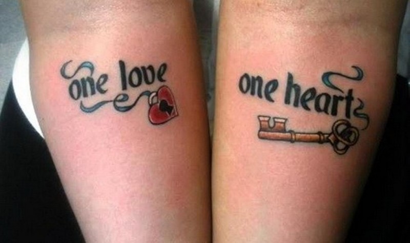 One love, one heart quote with key and heart tattoo on arm