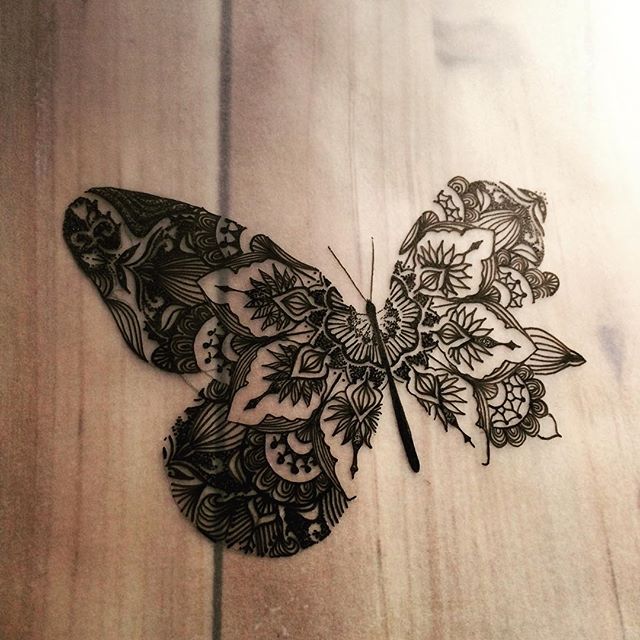Original black-line butterfly with folk ornament tattoo design