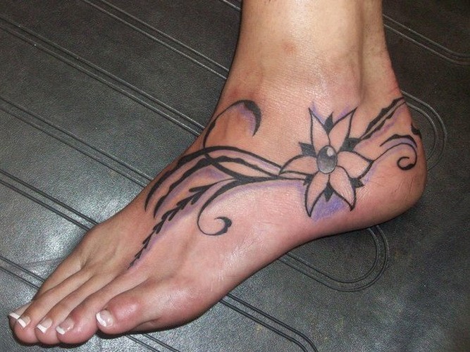 Pretty filigri flower tattoo for girls on foot