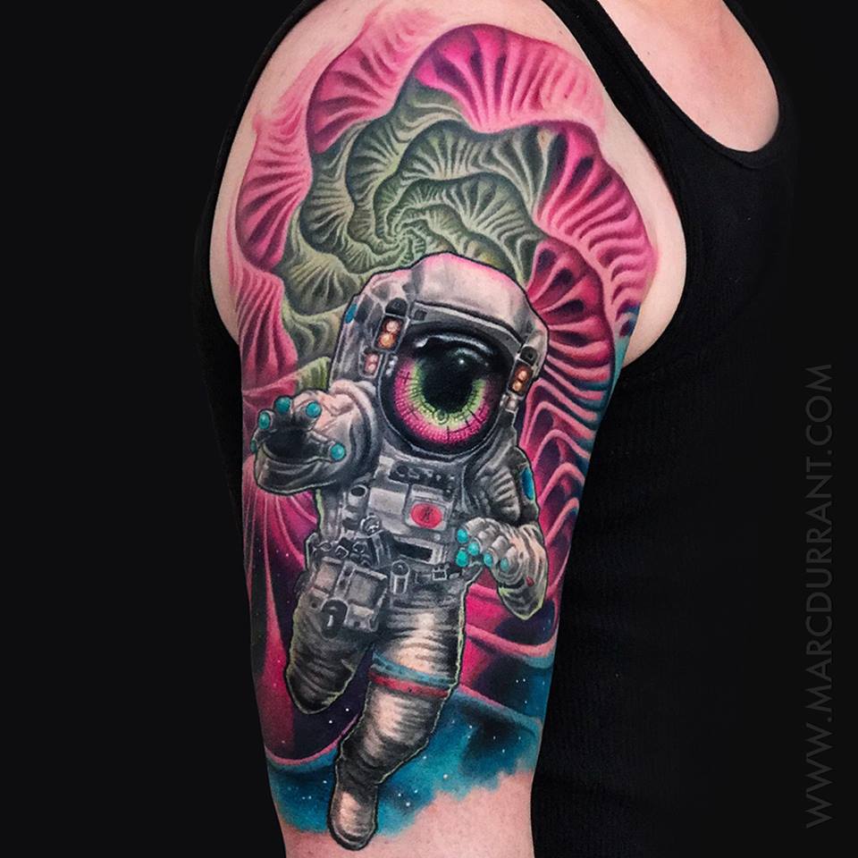 Psychedelic tattoo with the reflection of Burning Man in his visor