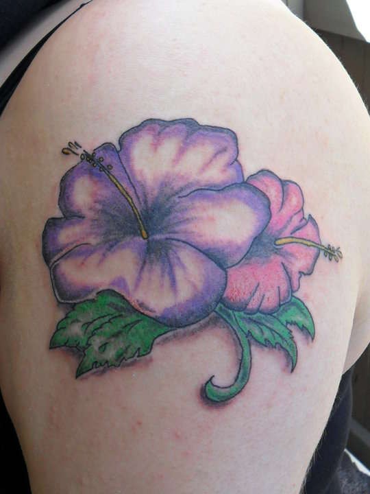 Purple-ink hawaiian hibiscus flower tattoo on upper arm