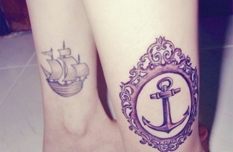 Purple anchor in ornate frame and a ship tattoo on ankle