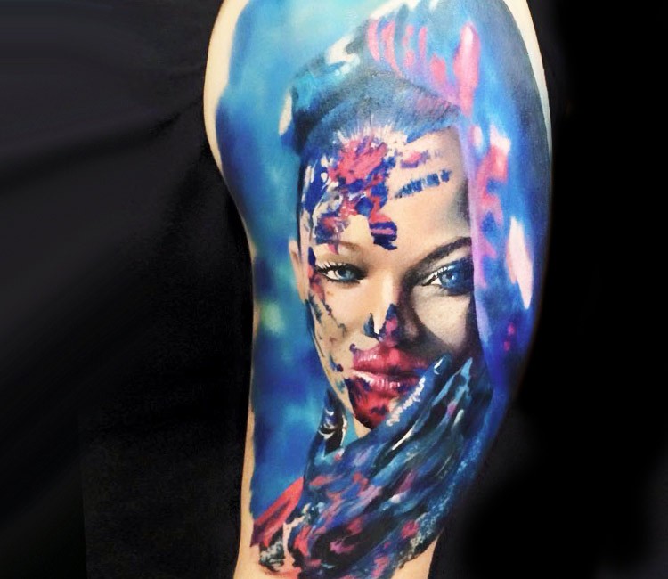 Real photo like colored upper arm tattoo of woman portrait with body art