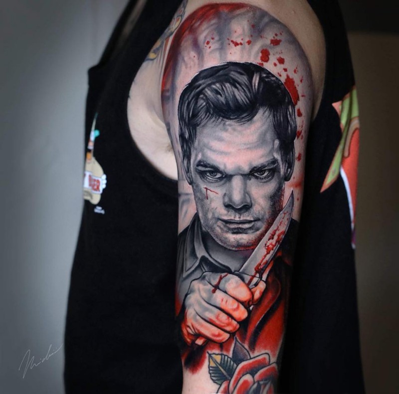 Realistic Dexter wit knife portrait tattoo on arm